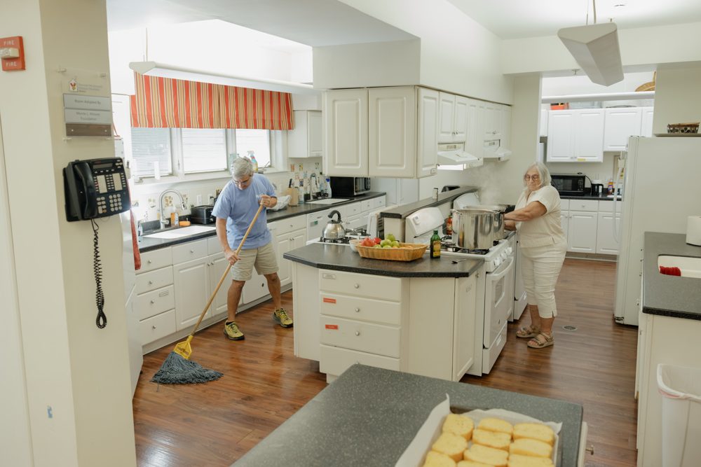 Volunteers cleaning the Ronald McDonald House kitchen