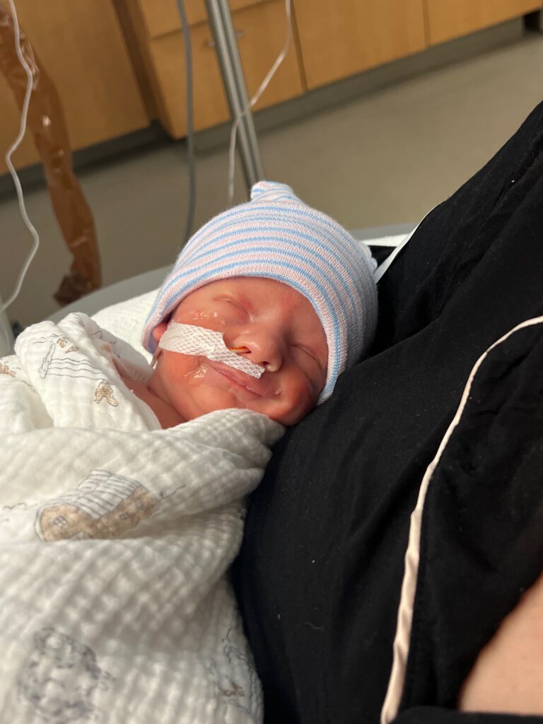 Baby Leo being held at the hospital.